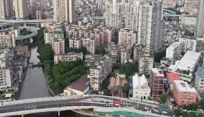 صينية ترفض بيع منزلها وتجبر الحكومة على بناء جسر للالتفاف عليه (صور)